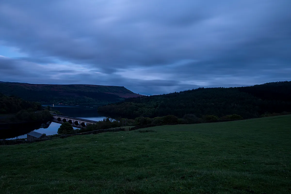 Dusk long exposure of the bridge over Ladybower Reservoir with car light trails, shot at 24mm