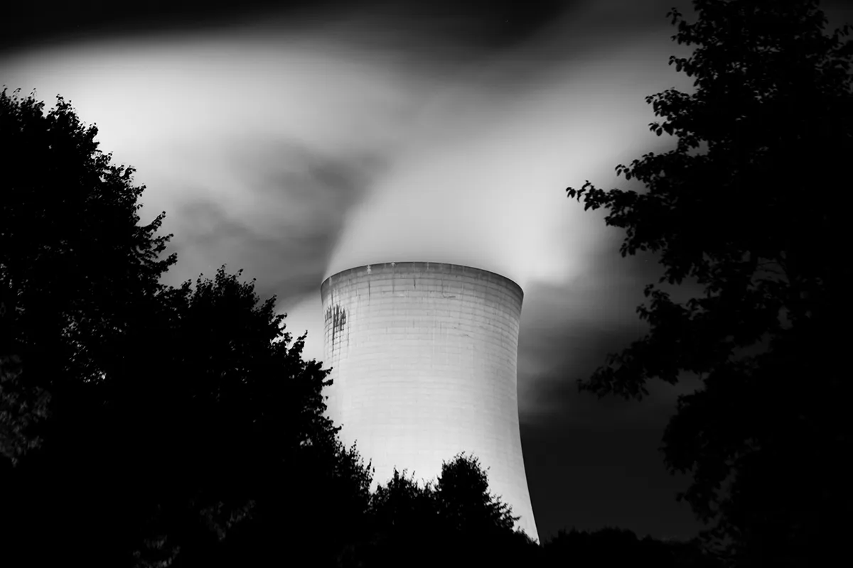 Drax cooling tower with steam pouring into the night sky, fine art photography