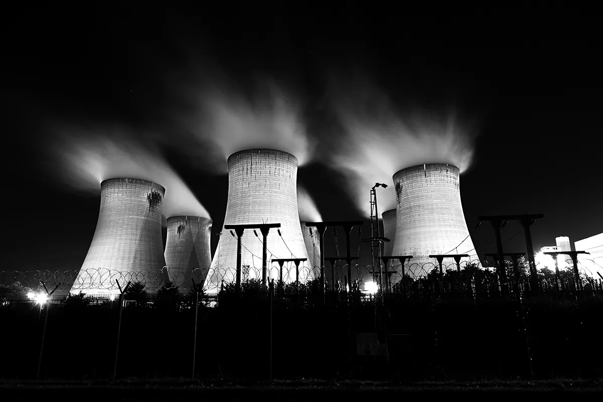 Drax Power Station cooling towers lit at night, black and white fine art long exposure