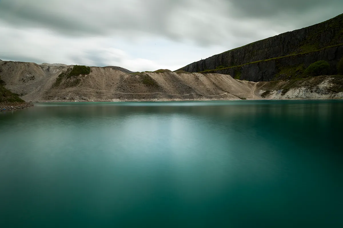 Turquoise water of Hoffman Quarry on the Buxton Blue Lagoon walk